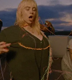 spraying herself
