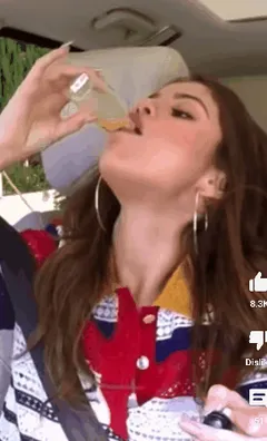 selena chugging a vial