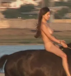 naked babe riding a horse