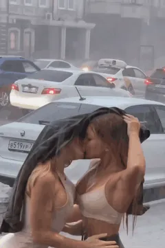 Pouring rain girlskissing